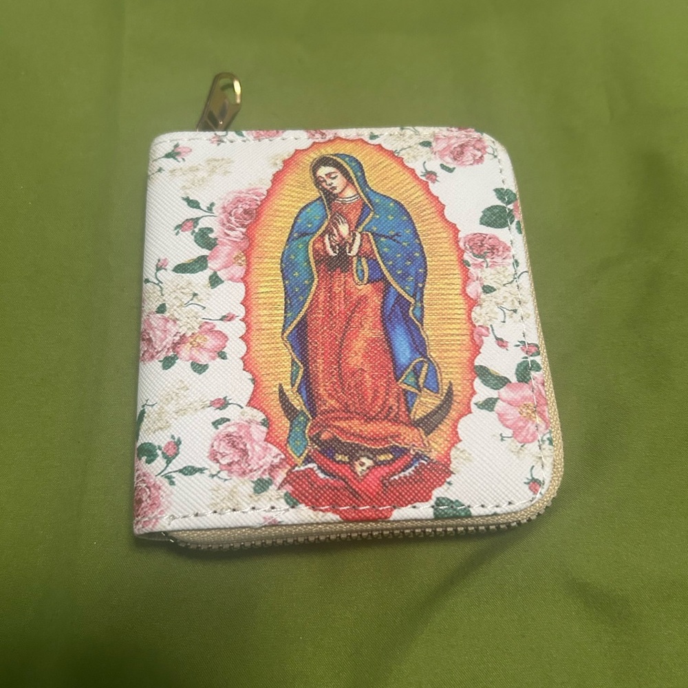 Mini wallet featuring a print of the Virgen de Guadalupe with pink floral design